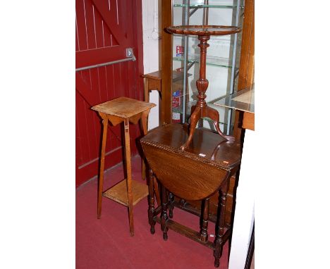 Occasional furniture to include; small oak gate leg table, two early 20th century oak two-tier plant stands, and a mahogany p