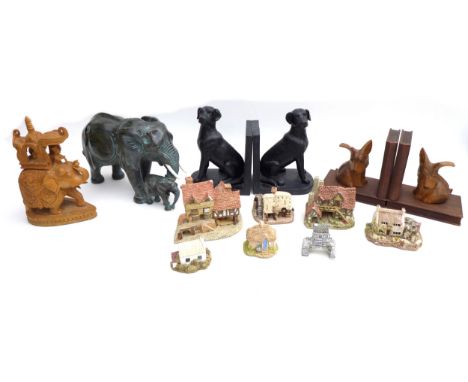 A group of collectables, comprising a hardstone elephant, 28cm long, a wooden elephant, two pairs of bookends, and seven cera
