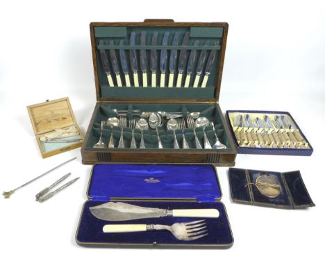 A group of silver plated items, including an oak canteen of cutlery, together with an oval yellow metal framed miniature port