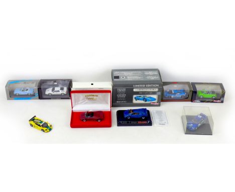 A group of eight 1/43 scale die-cast model cars, including a Minichamps BMW M1 Street and a Karmann Ghia, together with a lim