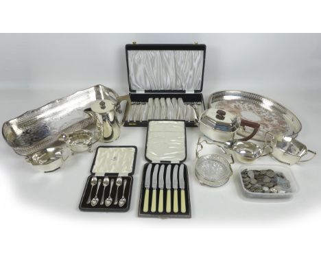 A group of silver plated items, including two trays, three piece tea service, sauce boats, cased sets of te and coffee spoons