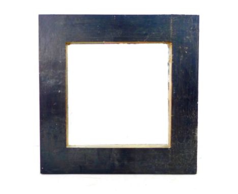 A modern wall mirror, square plate deep set in a wide black painted wooden frame with gold painted inner surface, 89.5 by 6 b