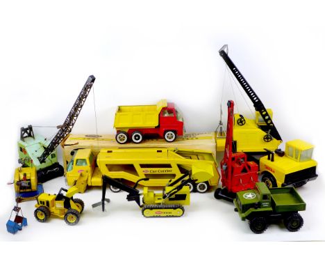 A collection of Tonka and other construction toys, including a Tonka Car Carrier with original box, cranes, a Mamod steam eng