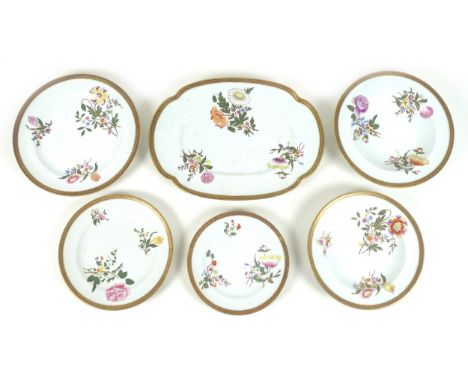 A late Victorian Royal Worcester part dinner service, hand painted decoration depicting sprays of flowers, gilt check rims, c