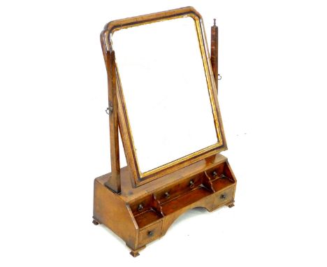 A George III mahogany toilet mirror, the rectangular plate with moulded frame and gilt slip, incuse upper corners, the steppe