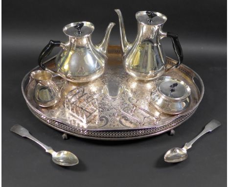 A collection of silver plated items, including a vintage Viners four piece tea service, oval tray, toast rack, and knife rest