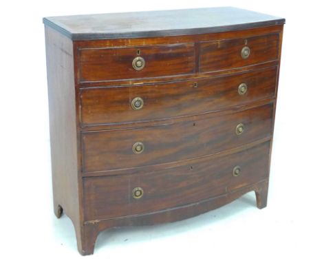 A mid 19th century mahogany bow front chest of two over three graduated drawers, with cock beading and brass ring handles, ra