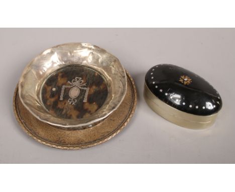 A silver pin dish assayed Birmingham 1931 along with a silver rimmed tortoise shell pin dish and a white metal trinket box.