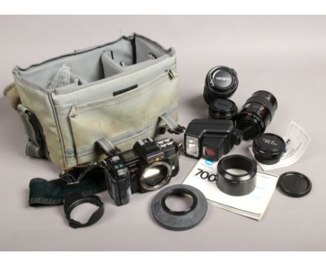 A Minolta 7000 35mm SLR camera in carry case with Minolta and Sigma lenses, manual etc.