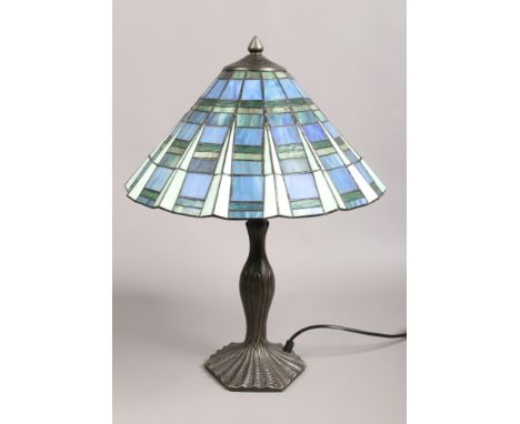 A Tiffany style table lamp with leaded and coloured glass shade.