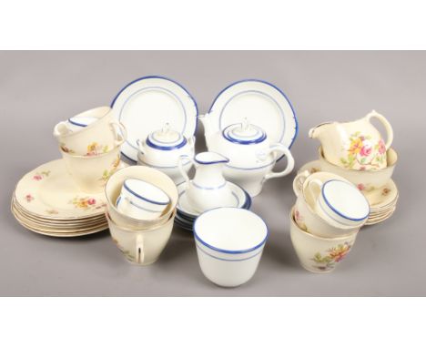 A six place floral transfer printed tea service stamped England 85 along with a blue and white part set.