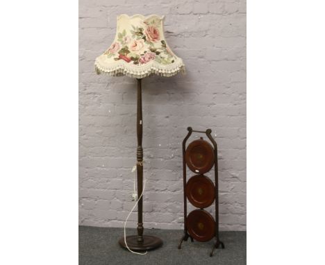 A turned mahogany standard lamp, along with a mahogany three tier cakestand.