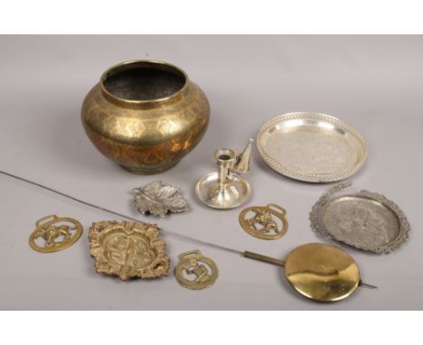 A collection of metalwares including Indian brass bowl, horse brasses, chamber stick with snuffer and a long case clock pendu