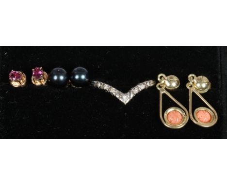 A 14ct gold wishbone ring and three pairs of 14ct gold earrings set with coral, ruby and pearl the pearls with accompanying c