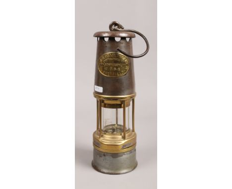 A Wolf Patterson miners safety lamp by W. M. Maurice Limited Sheffield.