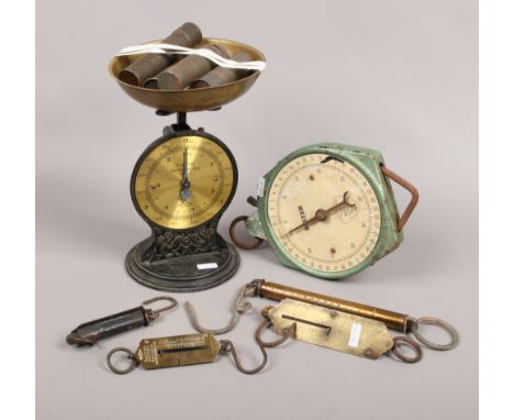 A collection of Salter scales to include family scales with early 20th century metal icing nozzles, spring milk scale, pocket