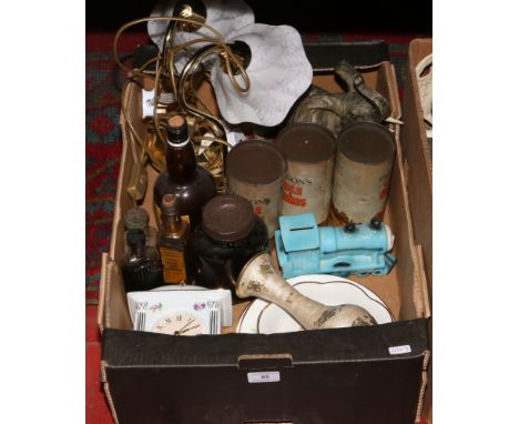 A box lot of miscellaneous to include table lamps, old bottles and tins, composite model of elephants ceramic quartz mantle c