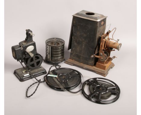 An early 20th century hand crank projector by J. Falk, along with a pathescope kid projector 9.5mm.