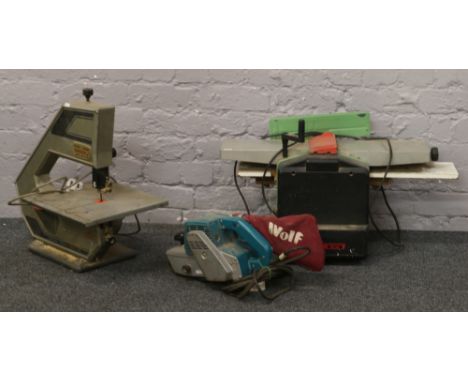 A powerline 2 speed bandsaw along with a Wolf 100mm belt sander and a Woody HM 160 wood work machine.