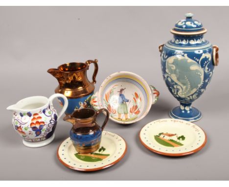 A mixed lot of ceramics to include a Quimper French faience, two handle porringer, copper lustre jugs (one damaged) and a lid