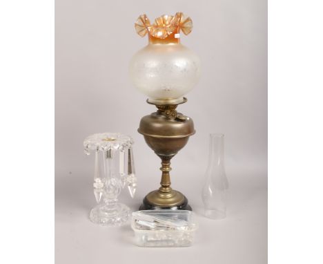 A brass oil lamp along with a frosted glass oil lamp shade and clear glass lustre (in need of attention).