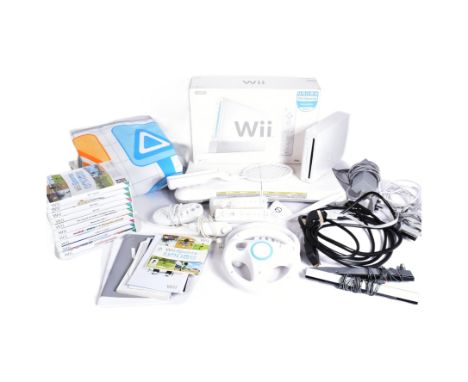 Retro Gaming - an original Nintendo Wii video game console (RVL-001) along with assorted Wii Sports accessories (balance boar