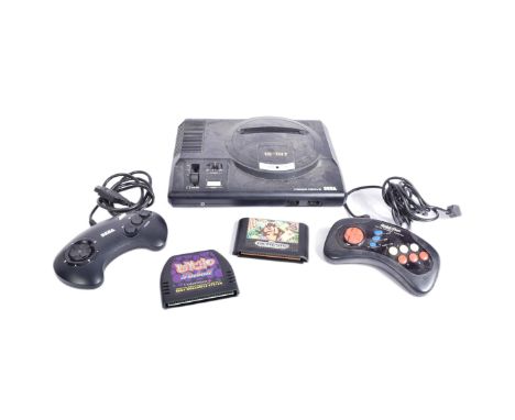 Retro Gaming - an original vintage Sega made Mega Drive games console, with some accessories - an original controller, a Quic