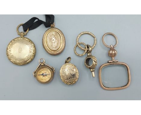 A 9ct gold fob set with a compass together with various lockets and a fob key 