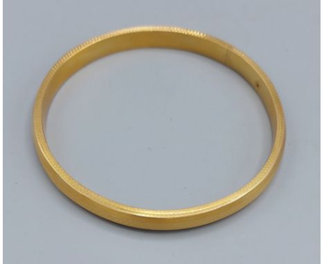 A 15ct gold bangle, 17.8gms 