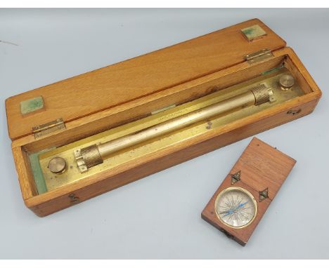 An early 19th Century mahogany cased pocket compass together with a cased brass rolling rule by Lawes Rabjohns Ltd 
