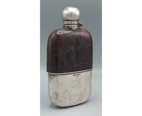 A Sheffield silver and leather Spirit flask by James Dixon and Sons, 7.5cms long 