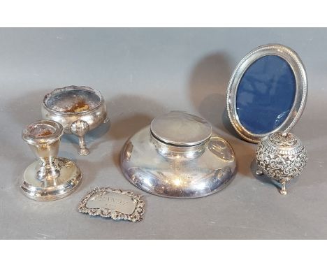 A London silver Capstan inkwell together with a Georgian silver salt, a silver dwarf candlestick, a silver decanter label, a 