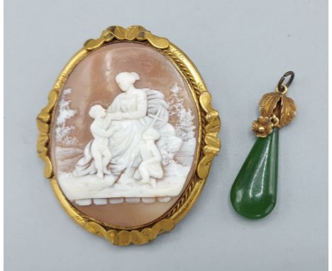 A 19th Century oval Cameo brooch, decorated in relief with figures, 5cms x 4cms together with a gold mounted Jade pendant 