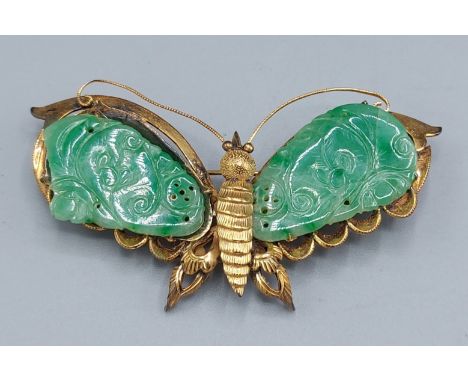 A Chinese yellow metal jade set brooch in the form of a Butterfly, 10.4gms, 6cms long 