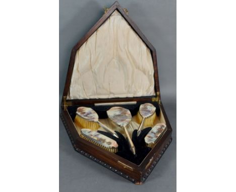 A Birmingham silver and enamel decorated five piece dressing table set in fitted oak case 