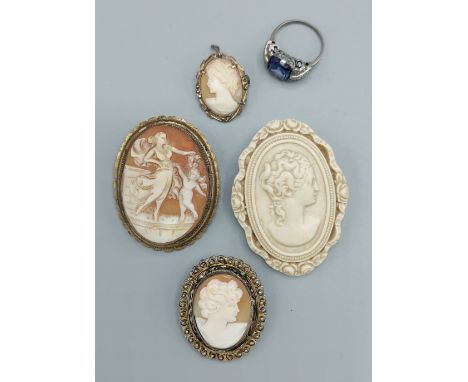 Four cameo brooches together with a dress ring 