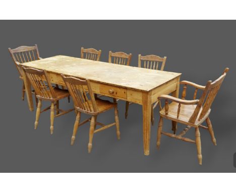 A pine Farmhouse table with three frieze drawers raised upon square legs, 219cms wide, 74.5cms deep and 74.5cms tall together