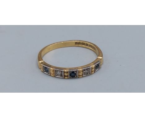 An 18ct gold ring set with three Sapphires and two Diamonds, 2.5gms, ring size M 