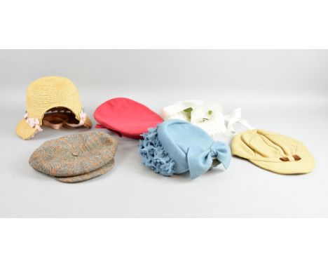 A collection of child's hats dating from the 1940s comprising a childs red felt hat, a blue felt bonnet with felt flower trim