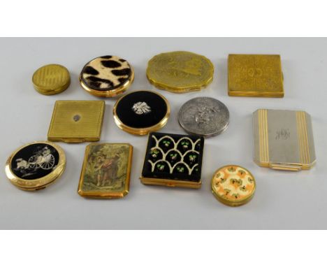 Group of Vintage compacts, one with engraved design of cherubs, others with classical scenes, a Cheetah skin compact and othe