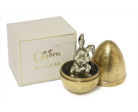 A Stuart Devlin novelty silver gilt egg, the gilt egg fitted with a bunny rabbit, in original 'Ogden of Harrogate Ltd. ' case