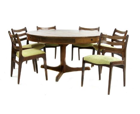 A rosewood circular dining table, § designed by Robert Heritage for Archie Shine Ltd., the top above four frieze drawers inte