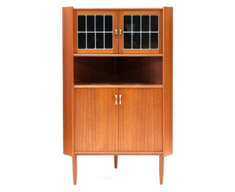 A Danish teak corner cupboard, with a glazed cupboard, over a shelf and a cupboard, 89cm wide 51cm deep 146cm high