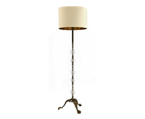A Birgit Israel standard lamp, with a plain shade, with glass and brass mounted stand, 170cm high