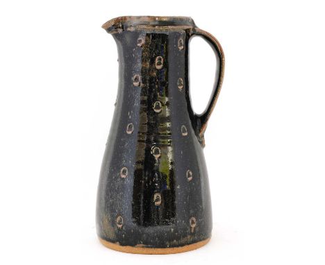 *Jim Malone (b.1946), a glazed stoneware jug, with a tenmoku glaze, with incised spots, artist's monogram and Ainstable mark,