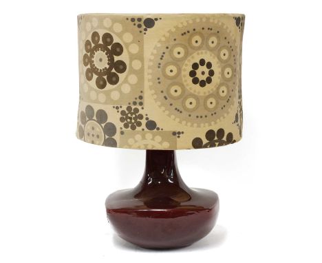 A Danish table lamp, with a pottery base and with the original printed shade, 55cm highProvenance: Kurt Heide (Oscar Woollens