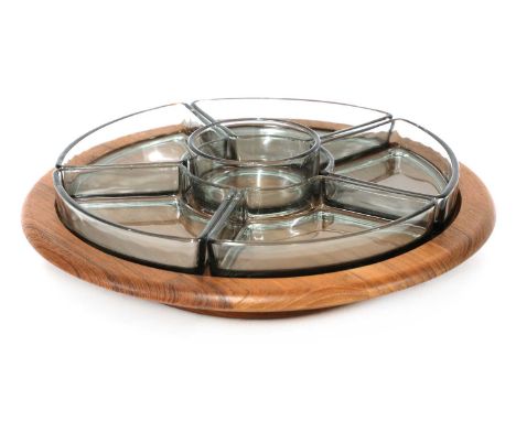 A Danish teak and glass lazy Susan, branded 'Digsmed', with Viking helmet motif, 31cm diameter
