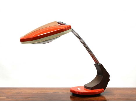 A Fase desk lamp, in orange and white, with a wood mount, on a revolving stand, moulded mark, 44cm high