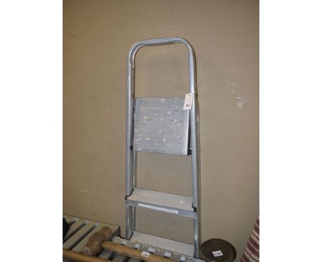 An aluminium folding step ladder; an oak gibbet style standard lamp; and a footstool.