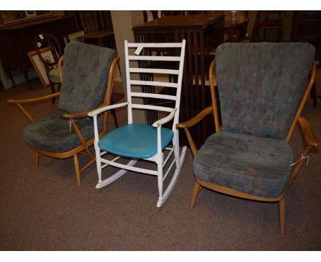 A pair of Ercol open arm easy chairs in light elm colour, fitted with loose seat and back cushions upholstered in patterned m